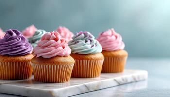 Colorful Cupcakes on Marble Surface with Copyspace Background Sweet Treats Concept photo