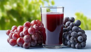 Refreshing Grape Juice in Glass Outdoor Garden Background Healthy Drink with Copyspace photo