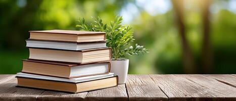 Books on Rustic Table with Green Background Copyspace for Text Nature-Inspired Scene photo