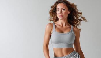 Vibrant Athletic Woman in Studio Background with Copyspace for Lifestyle Content photo