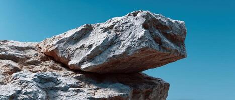 Rugged Stone with Sharp Edges Against Clear Blue Sky Nature Background Copyspace Concept photo