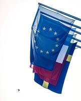 Peace dove and European Union flag and national flags of member states displaying unity photo
