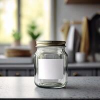 Small empty glass container jar with white blank label photo