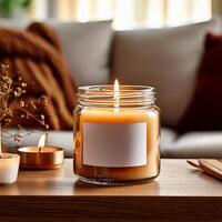 Candle glass container with with blank label, behind a warm aesthetic living room photo