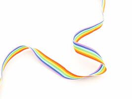 Top view of a rainbow cloth ribbon on a white background. Close-up. photo