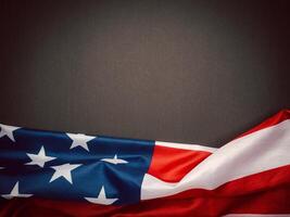 Part of the American flag is on a black background with copy space for text. photo