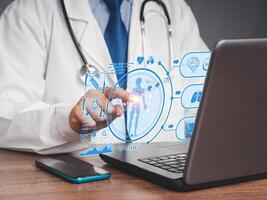 Close-up of a doctor in a uniform read a report health patient checkup on a virtual screen while sitting in the hospital photo