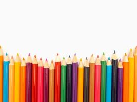 Close-up of multicolored pencils isolated on white background photo