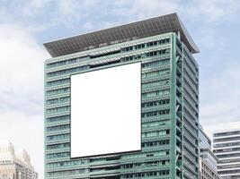 Mockup white vertical large LED display billboard on tower building. clipping path for mockup photo