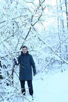 A person finds themselves in a beautiful Winter Wonderland, surrounded by snowy branches photo