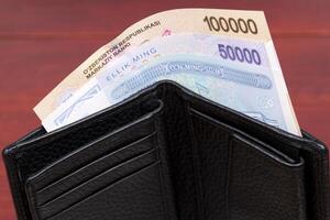 Uzbekistani money - sum in the black wallet photo