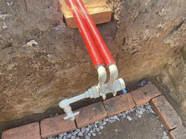 Insulating plumbing pipes with thermal foam wrap 2 photo