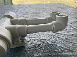 Various plumbing pipes and fittings in workshop 5 photo