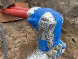 Insulating plumbing pipes with thermal foam wrap 8 photo