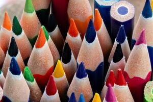 Close-Up of Sharpened Colored Pencils.Creative Vibrant Color Pencils in Macro. Sharpened Rainbow-Colored Pencils Arranged Vertically photo