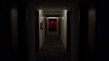 Dim lighting casting mysterious shadows along deserted hotel corridor, slowly revealing vibrant red elevators emerging from darkness with haunting cinematic atmosphere video