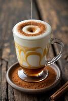 A beautifully layered coffee drink with frothy milk and cocoa topping on a rustic wooden table. photo