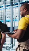 Vertical Photovoltaics smart factory expert designing production lines for assembly facility in CAD program. Industry 4.0 solar panels plant technician uses software to optimize floor layouts, camera A video