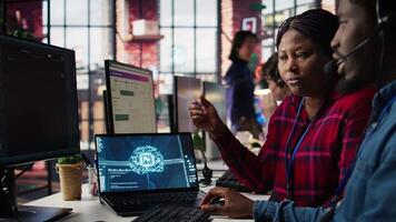 Call center agents using artificial intelligence tech to provide step by step guidance to customers. Customer center coworkers using AI technology to walk clients through technical solutions, camera B video