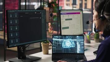 Call center agents track shipments in office using AI chatbot for help. Customer center workers use artificial intelligence assistance to locate clients packages and provide status updates, camera A video
