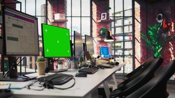 Customer support office with green screen PC used to assist customers with technical issues and diagnosing problems. Call center workspace with chroma key computer used to do complaint resolution video