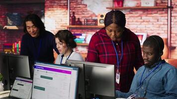 Portrait of smiling multiethnic call center agents helping customers regain access to accounts. Happy multiracial workers in diverse customer center assisting clients needing help, camera A video