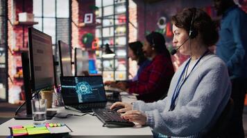 Call center agent uses artificial intelligence to enhance customer interactions and resolve inquiries efficiently. Woman in customer service office using AI communication technologies, camera B video