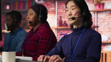Call center admin team working together to provide live chat support, handling clients complaints. Teamworking colleagues in office dealing with unsatisfied customers, providing solutions, camera A video