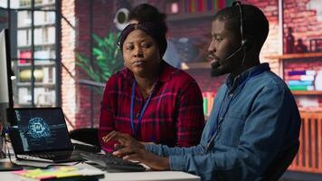 Call center manager teaching intern how to use AI to enhance customer interactions. Team leader in customer service office explaining trainee how to use artificial intelligence, camera A video