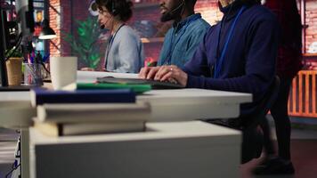 Call center agent helping customers regain access to accounts, diagnosing problems. Customer center staff member assisting clients needing help, providing accurate information, camera B video