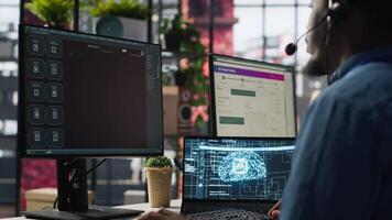 Call center worker in office using AI chatbot to answer customer questions. Man doing customer service job using artificial intelligence, generating automated responses providing solutions, camera A video