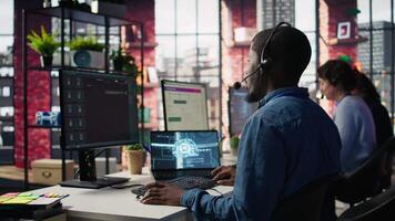 Call center employee using artificial intelligence chatbot to provide multilingual support to customers. Customer support operator leveraging AI tools to translate clients interactions, camera B video