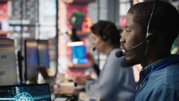 Call center employee using artificial intelligence chatbot to provide multilingual support to customers. Customer support operator leveraging AI tools to translate clients interactions, camera A video