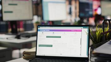 Package tracking software displayed on laptop screen in call center logistics department. Notebook in office showing app doing parcels shipment monitoring, searching for items lost in transit video