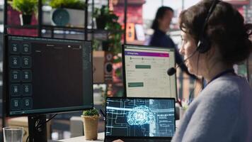 Worker providing live chat support, typing on keyboard, using AI chatbot to handle clients complaints. Call center agent dealing with unsatisfied customers using artificial intelligence LLM, camera A video