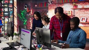 Portrait of smiling multiethnic call center agents helping customers regain access to accounts. Happy multiracial workers in diverse customer center assisting clients needing help, camera B video