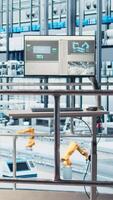 Vertical Monitor displaying industrial analytics dashboard for Industry 4.0 photovoltaics plant equipment. Solar panels smart factory display visualizing robotic arms performance and metrics from sensor data video