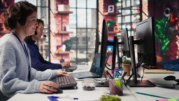 Team of call center agents tracking shipments in office, handling delivery delays. Customer center coworkers use software to locate clients packages and provide status updates, camera B video