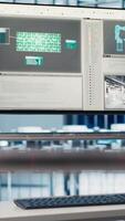 Vertical Monitor in industry 4.0 industrial plant used to automate robotic machines, handheld camera shot. Close up of display in smart factory used to oversee implementation of AI in facility equipment video