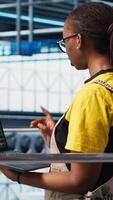Vertical Engineers working in smart factory, collecting and analyzing data. Technicians using tracking software in industry 4.0 industrial plant equipped with advanced sensors, camera A video