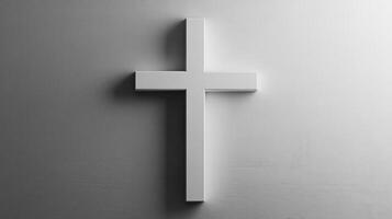 Minimalist white christian cross on light gray wall photo