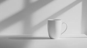 Minimalist white mug in sunlit setting with soft shadows photo