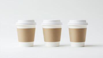 Three eco-friendly coffee cups with brown sleeves on a white background photo