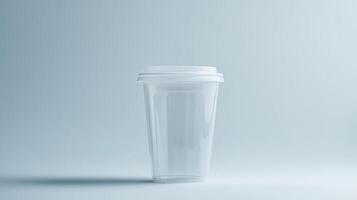 Transparent plastic cup with lid on light background photo