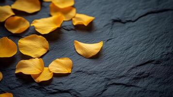 Minimalist composition with golden petals on textured surface for artistic decor.Vishu day photo