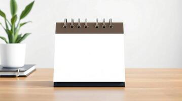 A blank notepad on a wooden desk photo