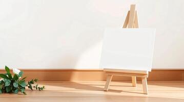 Mockup of easel with blank canvas in a room with white wall photo
