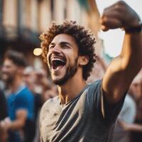 A man with an afro is cheering in the street photo