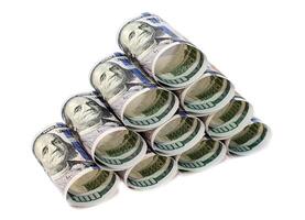 One hundred dollar bills rolled and stacked in a pyramid isolated on a white background photo