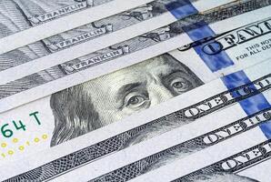 Row of US hundred dollar banknotes closeup photo